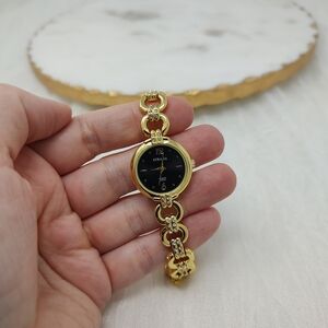 Strada women's watch light gold tone and dark blue round face small crystals